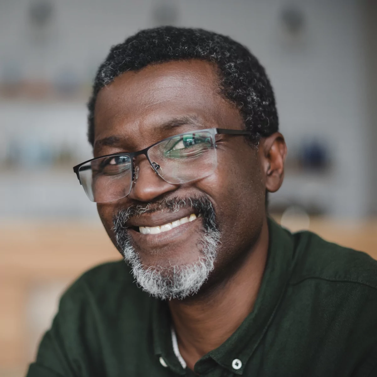 A man smiling after the restorative benefits of dental crowns in Elgin.